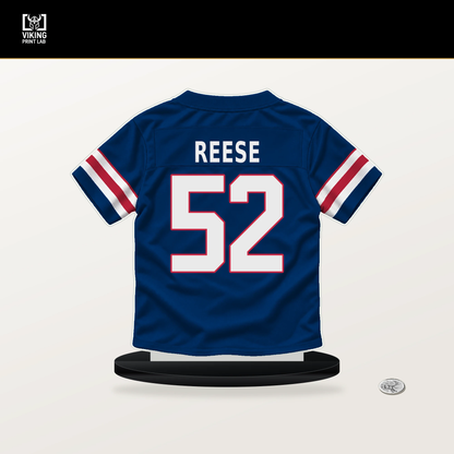 Arvell Reese number 52 New York Giants jersey stand with included black base.