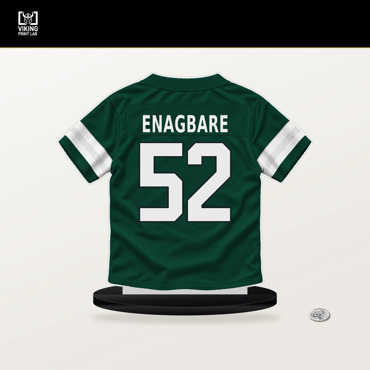 Kingsley Enagbare number 52 New York Jets jersey stand with included black base.