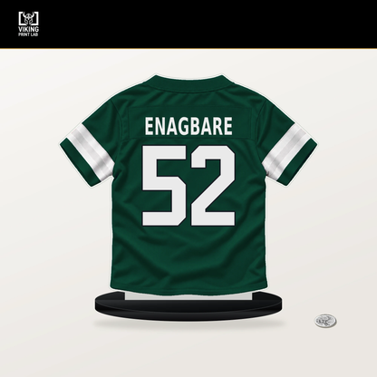 Kingsley Enagbare number 52 New York Jets jersey stand with included black base.
