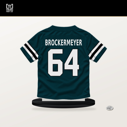 James Brockermeyer number 64 Philadelphia Eagles jersey stand with included black base.