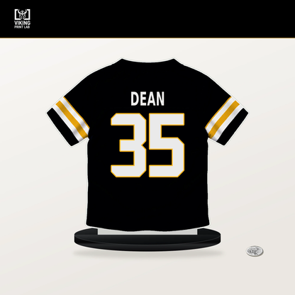 Jamel Dean number 35 Pittsburgh Steelers jersey stand with included black base.