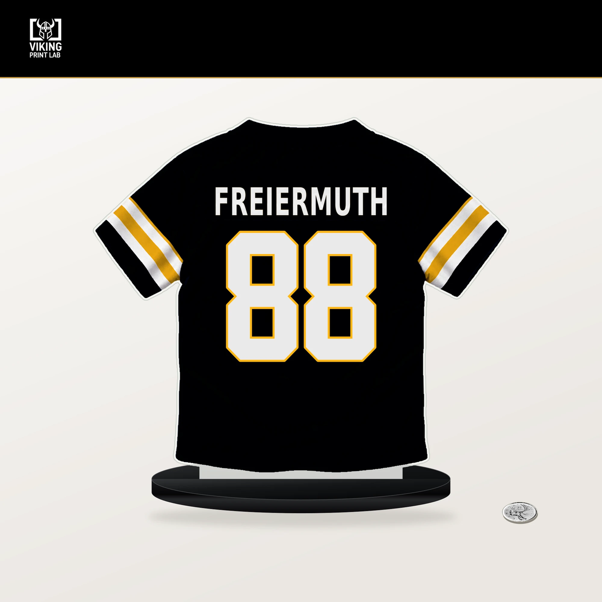 Pat Freiermuth number 88 Pittsburgh Steelers jersey stand with included black base.