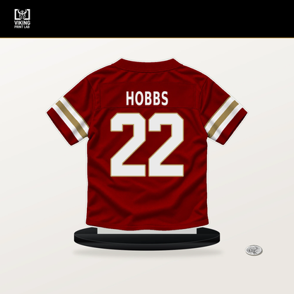 Nate Hobbs number 22 San Francisco 49ers jersey stand with included black base.