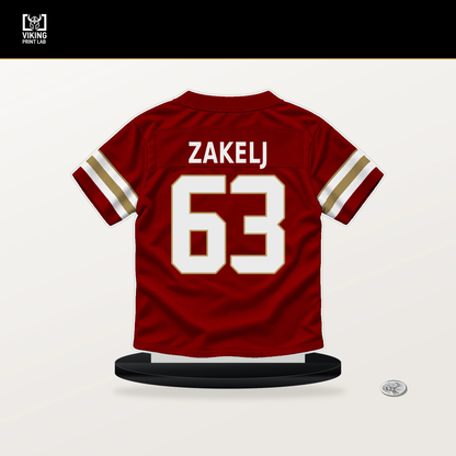 Nick Zakelj number 63 San Francisco 49ers jersey stand with included black base.