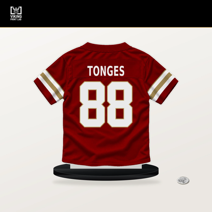 Jake Tonges number 88 San Francisco 49ers jersey stand with included black base.