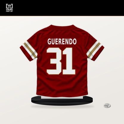 Isaac Guerendo number 31 San Francisco 49ers jersey stand with included black base.