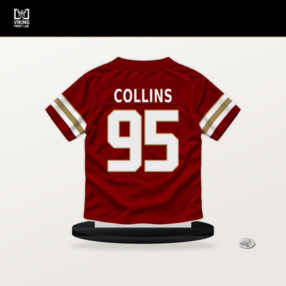 Alfred Collins number 95 San Francisco 49ers jersey stand with included black base.