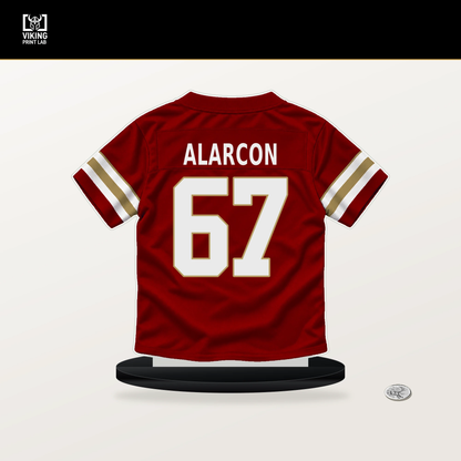 Isaac Alarcon number 67 San Francisco 49ers jersey stand with included black base.