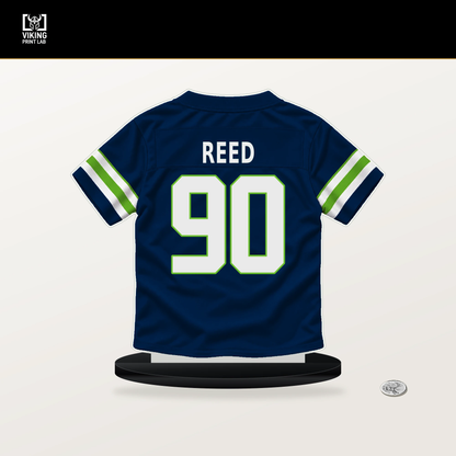 Jarran Reed number 90 Seattle Seahawks jersey stand with included black base.