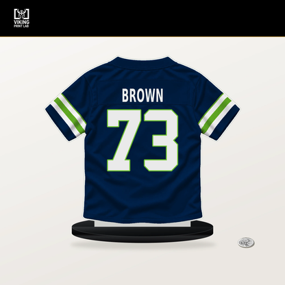 Logan Brown number 73 Seattle Seahawks jersey stand with included black base.