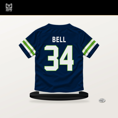 D'Anthony Bell number 34 Seattle Seahawks jersey stand with included black base.