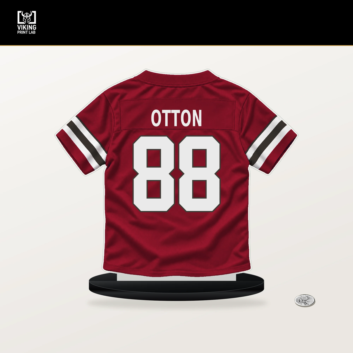 Cade Otton number 88 Tampa Bay Buccaneers jersey stand with included black base.