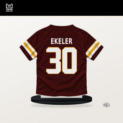 Austin Ekeler number 30 Washington Commanders jersey stand with included black base.