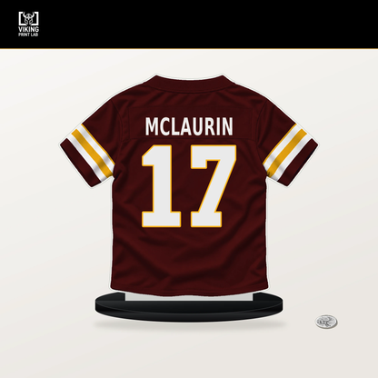 Terry McLaurin number 17 Washington Commanders jersey stand with included black base.