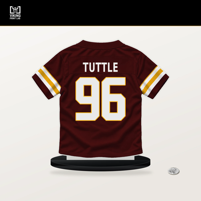 Shy Tuttle number 96 Washington Commanders jersey stand with included black base.