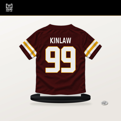 Javon Kinlaw number 99 Washington Commanders jersey stand with included black base.