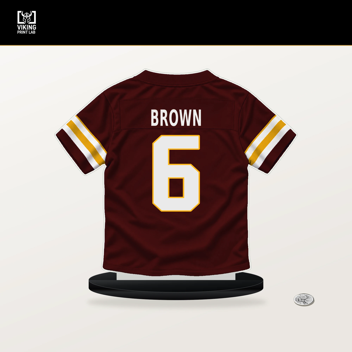 Dyami Brown number 6 Washington Commanders jersey stand with included black base.