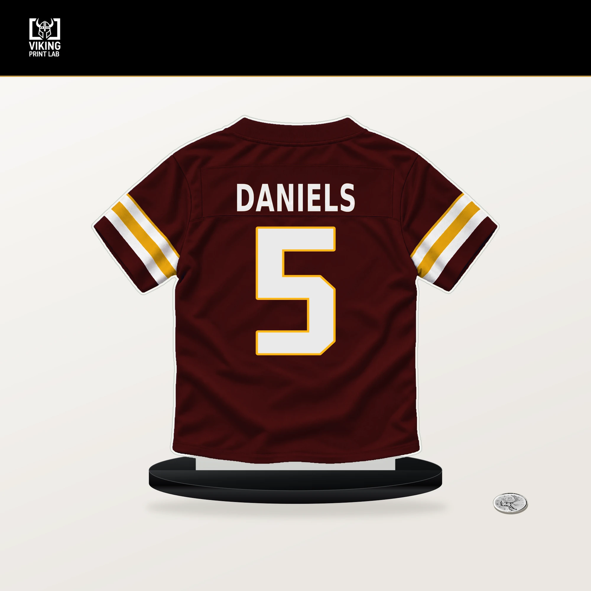 Jayden Daniels number 5 Washington Commanders jersey stand with included black base.