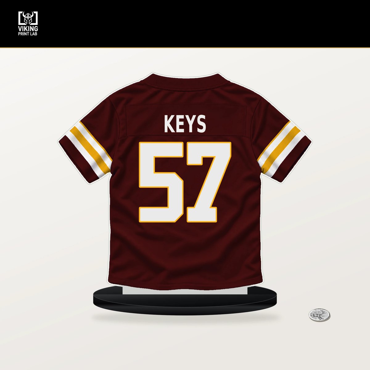 Austin Keys number 57 Washington Commanders jersey stand with included black base.