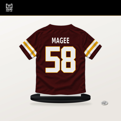 Jordan Magee number 58 Washington Commanders jersey stand with included black base.