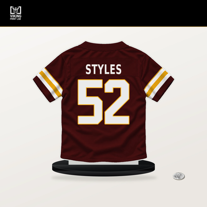 Sonny Styles number 52 Washington Commanders jersey stand with included black base.