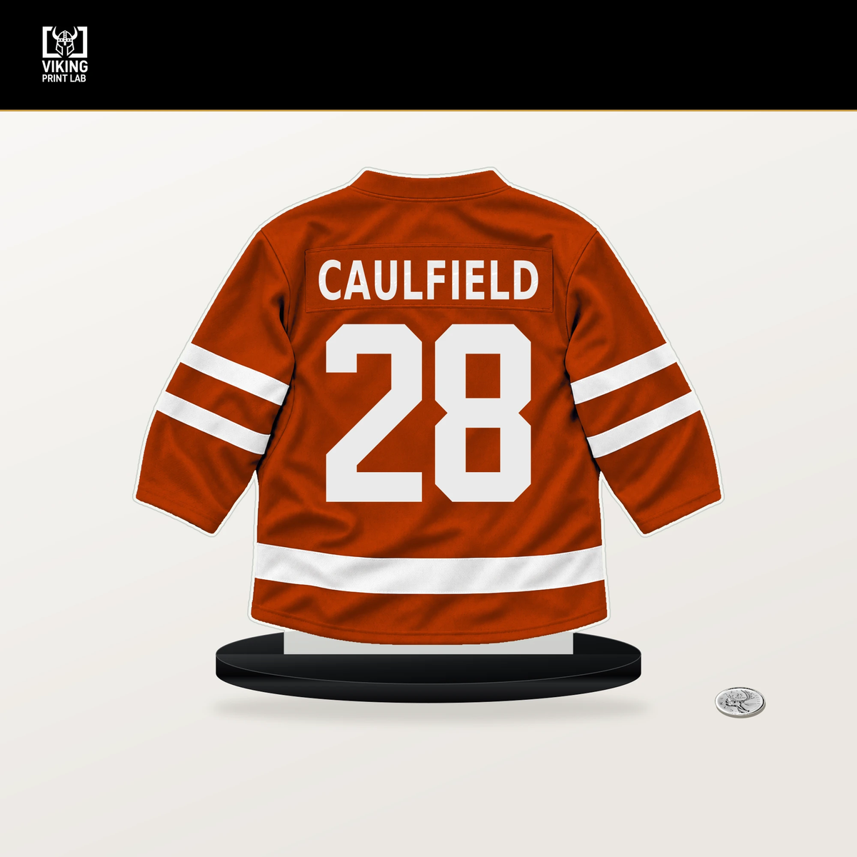 Judd Caulfield number 28 Anaheim Ducks jersey stand with included black base.