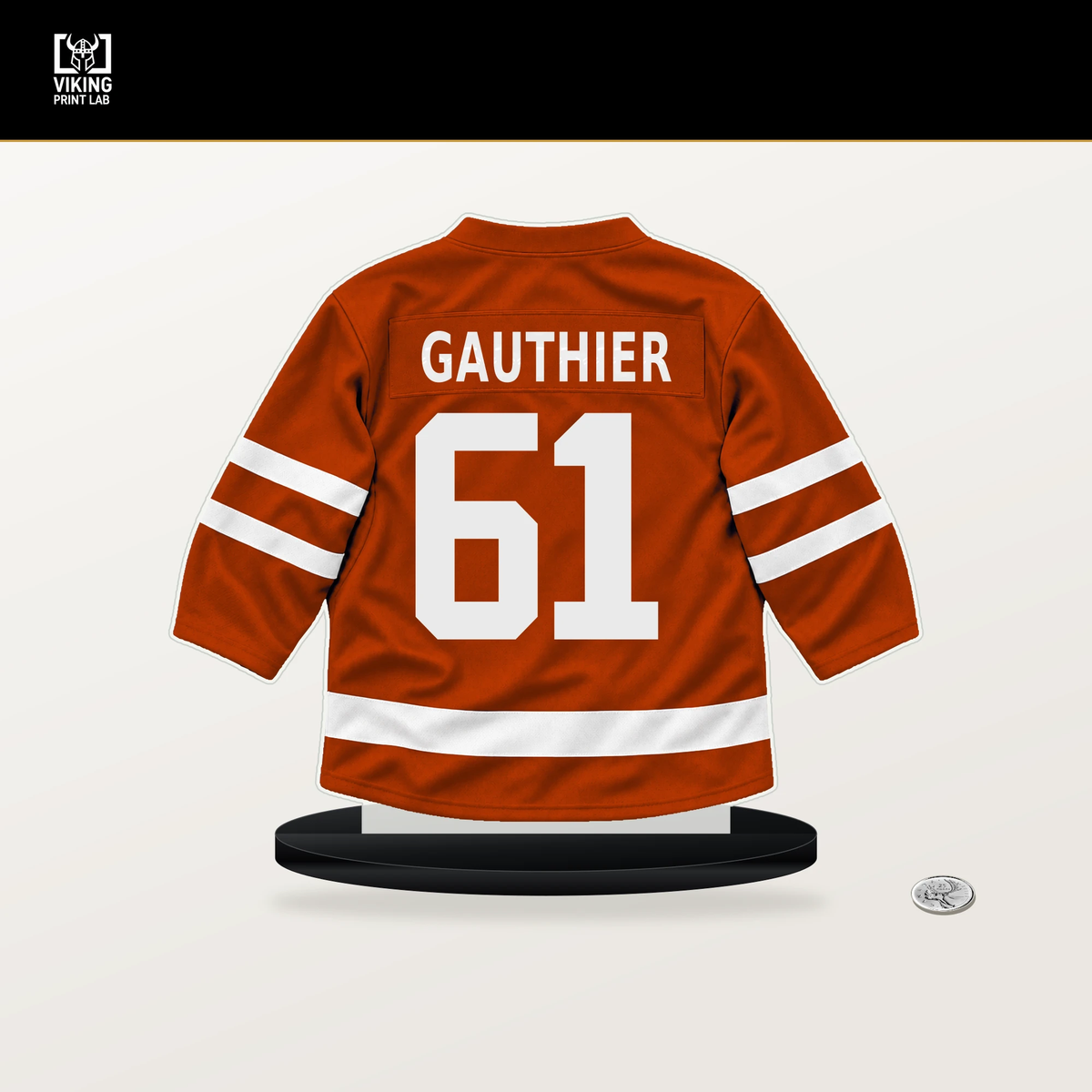Cutter Gauthier number 61 Anaheim Ducks jersey stand with included black base.