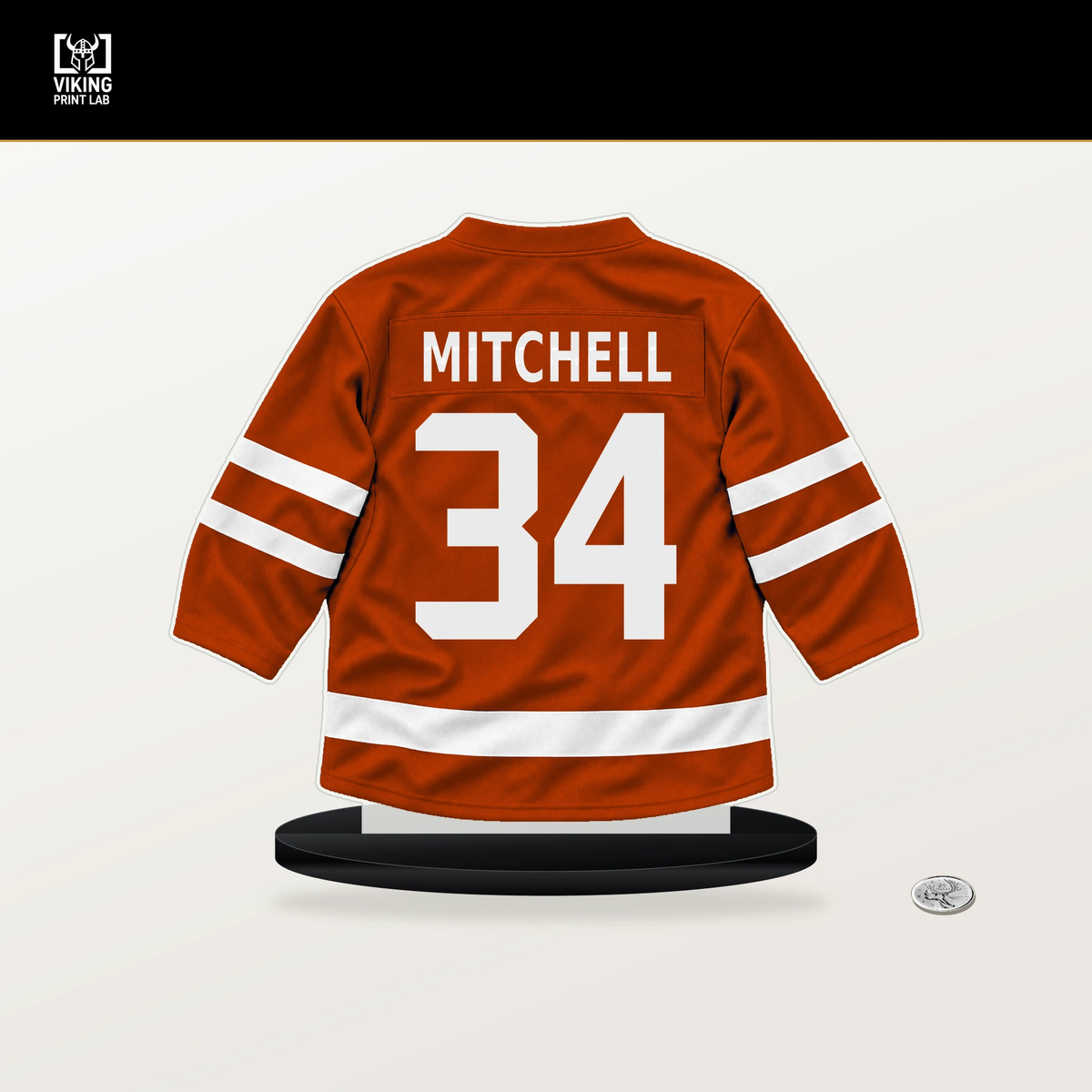 Travis Mitchell number 34 Anaheim Ducks jersey stand with included black base.