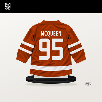 Roger McQueen number 95 Anaheim Ducks jersey stand with included black base.