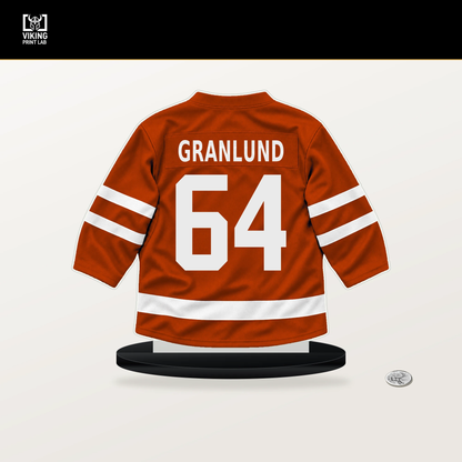 Mikael Granlund number 64 Anaheim Ducks jersey stand with included black base.
