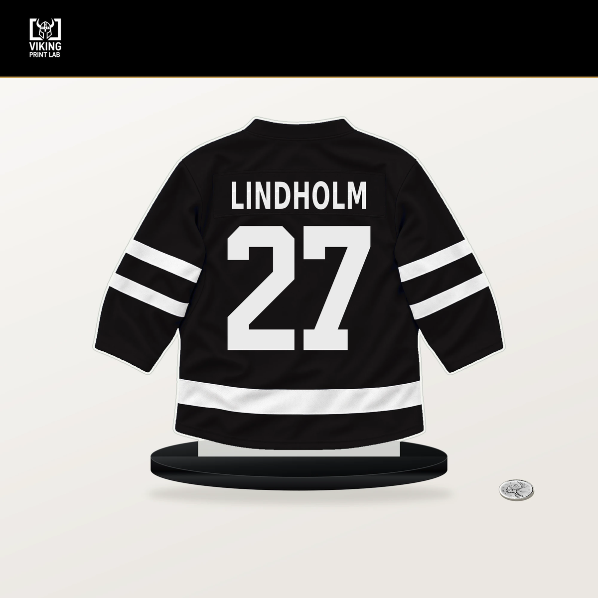 Hampus Lindholm number 27 Boston Bruins jersey stand with included black base.