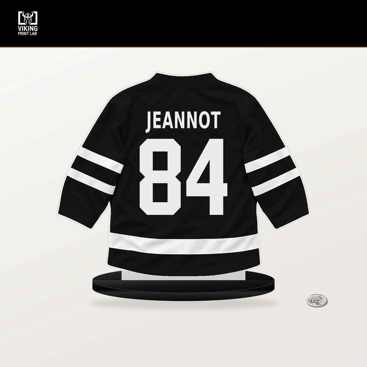 Tanner Jeannot number 84 Boston Bruins jersey stand with included black base.