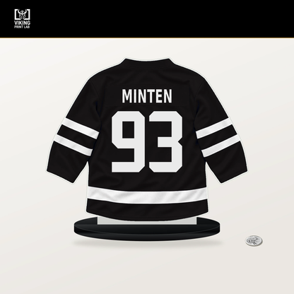 Fraser Minten number 93 Boston Bruins jersey stand with included black base.