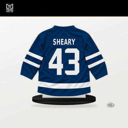 Conor Sheary number 43 Buffalo Sabres jersey stand with included black base.