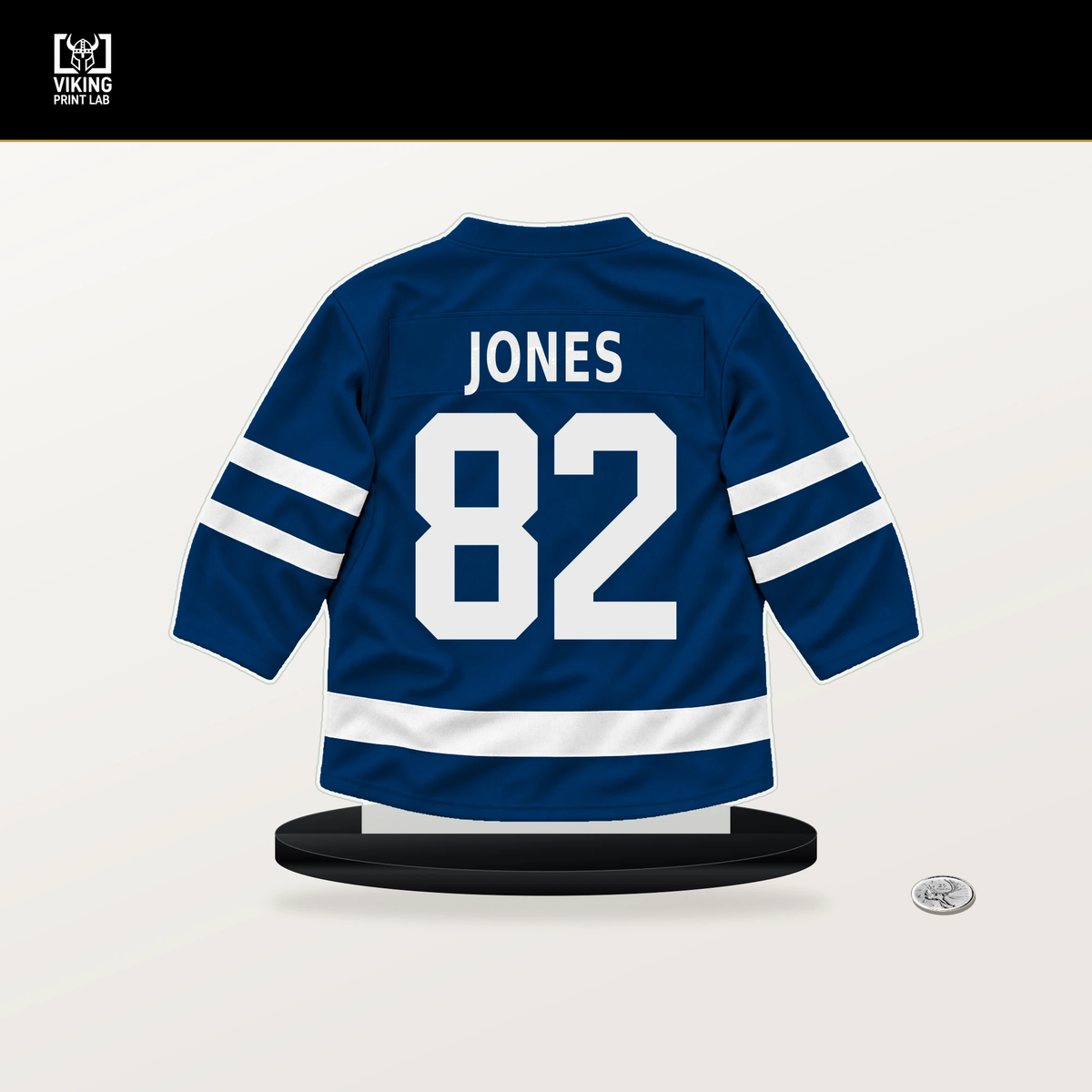 Caleb Jones number 82 Buffalo Sabres jersey stand with included black base.