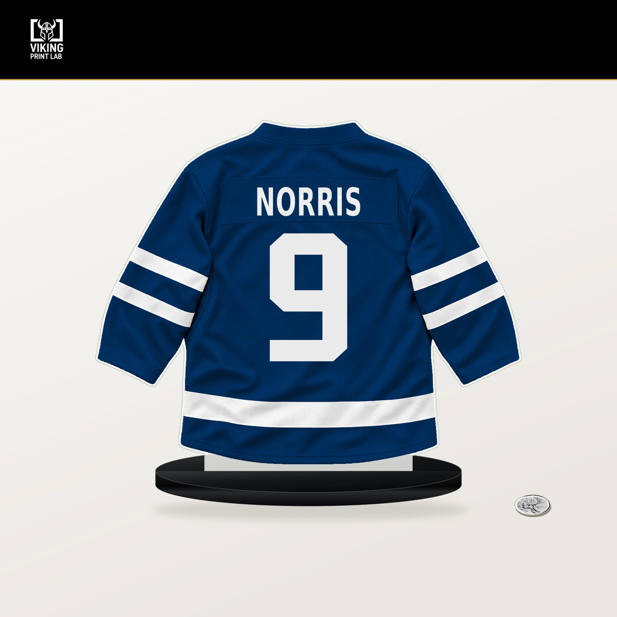 Josh Norris number 9 Buffalo Sabres jersey stand with included black base.