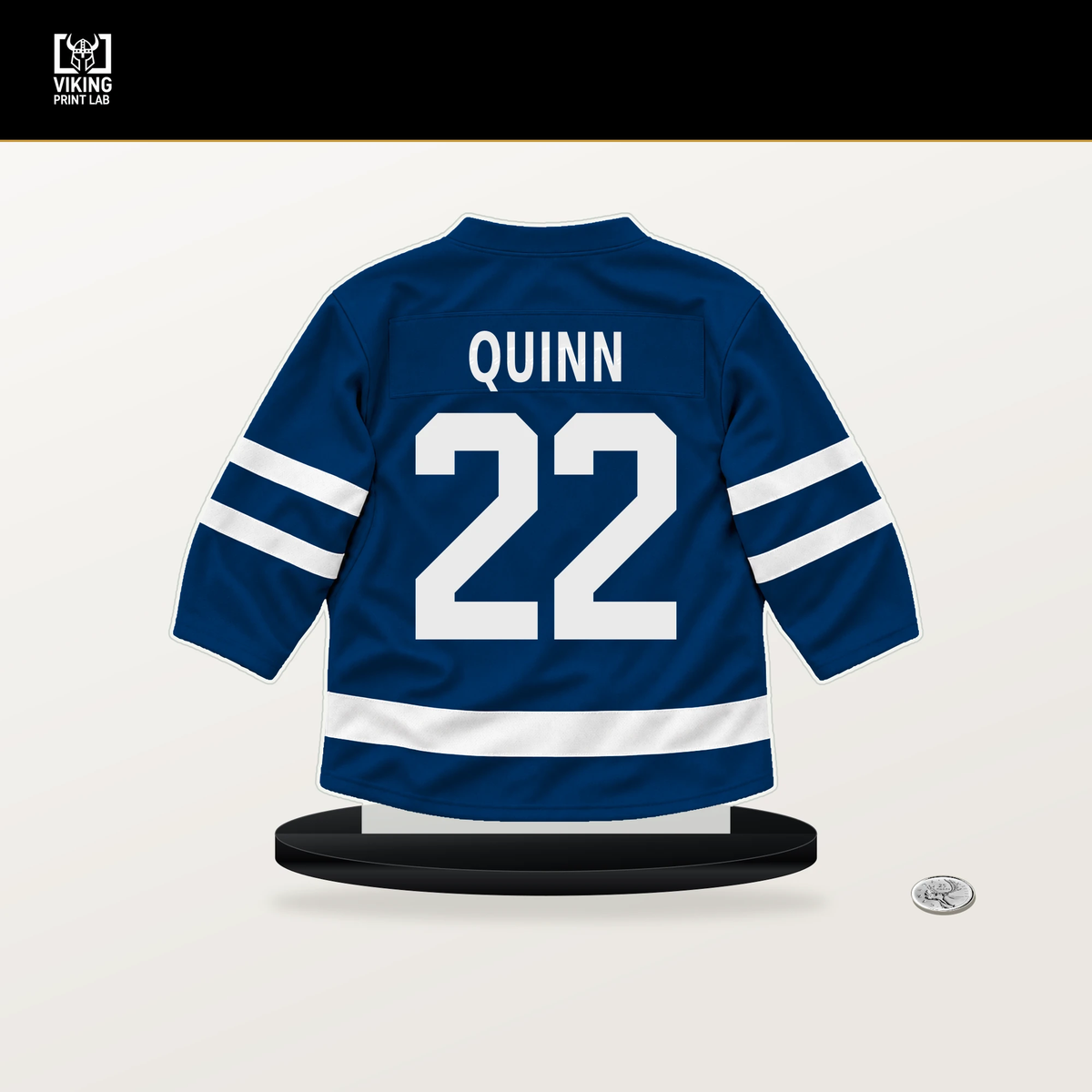 Jack Quinn number 22 Buffalo Sabres jersey stand with included black base.
