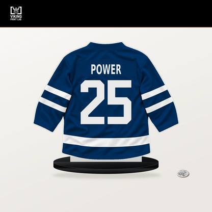 Owen Power number 25 Buffalo Sabres jersey stand with included black base.
