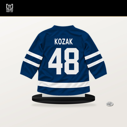 Tyson Kozak number 48 Buffalo Sabres jersey stand with included black base.