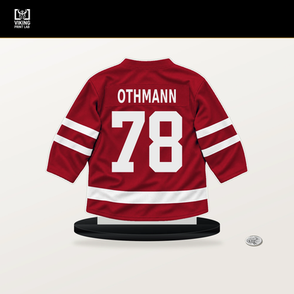 Brennan Othmann number 78 Calgary Flames jersey stand with included black base.