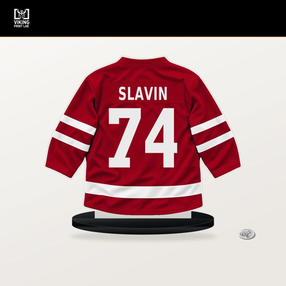 Jaccob Slavin number 74 Carolina Hurricanes jersey stand with included black base.