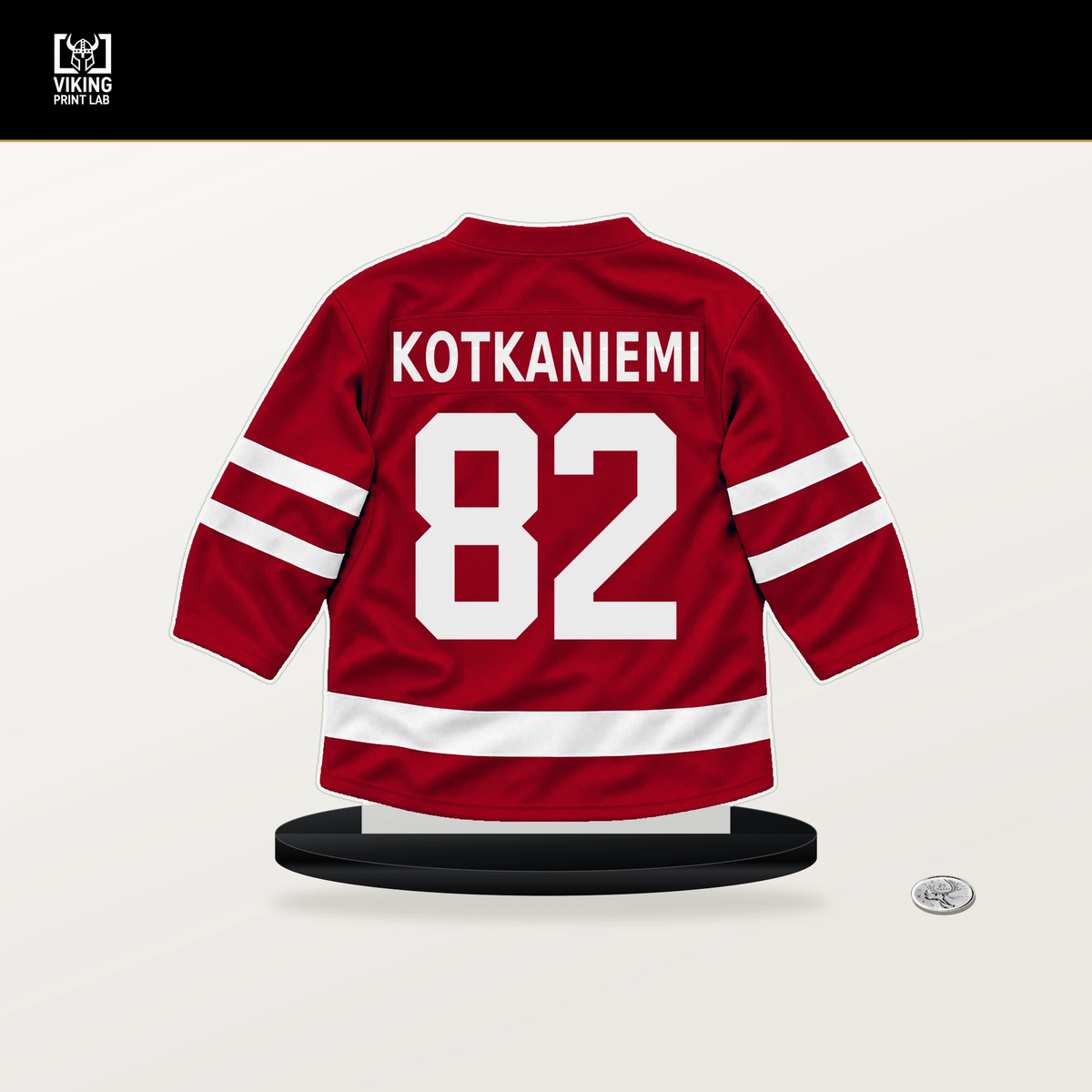 Jesperi Kotkaniemi number 82 Carolina Hurricanes jersey stand with included black base.