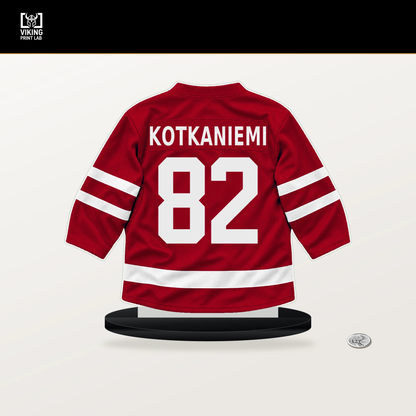 Jesperi Kotkaniemi number 82 Carolina Hurricanes jersey stand with included black base.
