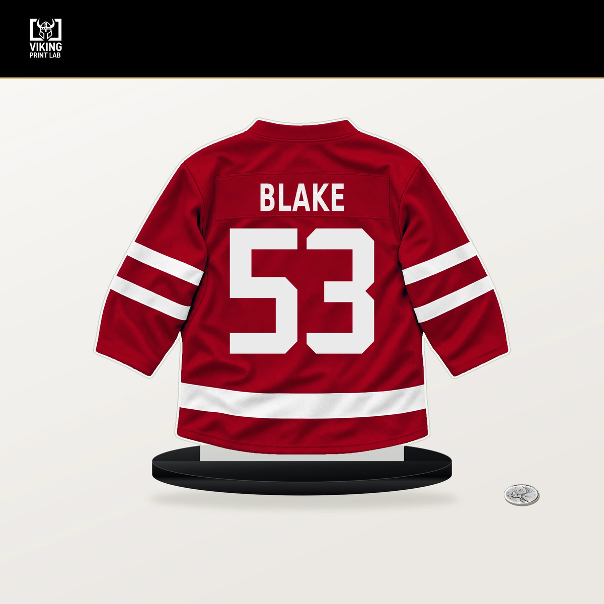 Jackson Blake number 53 Carolina Hurricanes jersey stand with included black base.