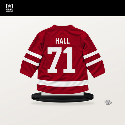 Taylor Hall number 71 Carolina Hurricanes jersey stand with included black base.