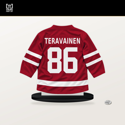 Teuvo Teravainen number 86 Chicago Blackhawks jersey stand with included black base.