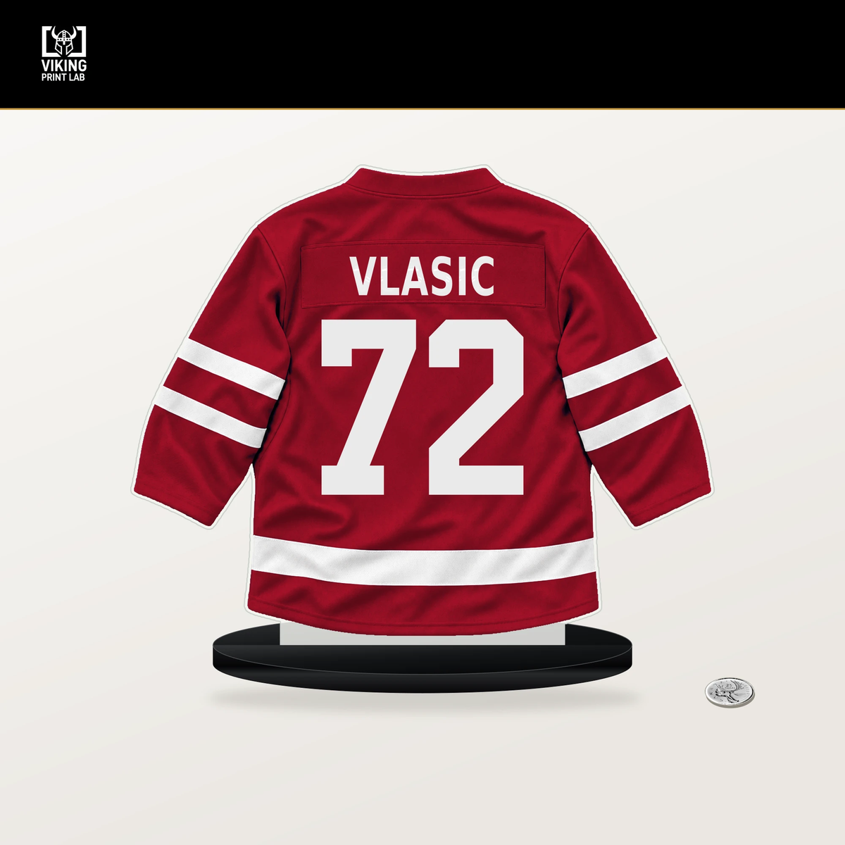 Alex Vlasic number 72 Chicago Blackhawks jersey stand with included black base.
