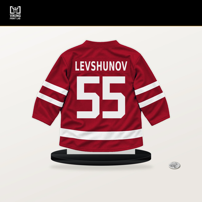 Artyom Levshunov number 55 Chicago Blackhawks jersey stand with included black base.