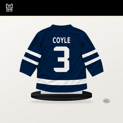 Charlie Coyle number 3 Columbus Blue Jackets jersey stand with included black base.