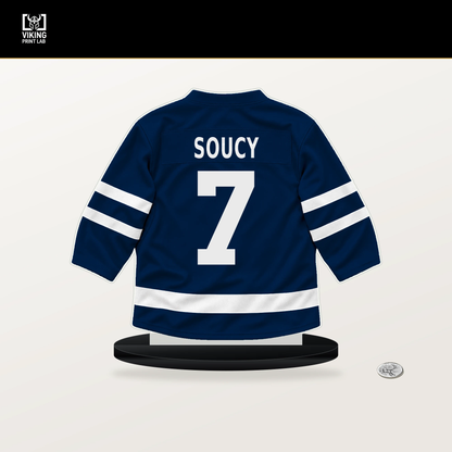 Carson Soucy number 7 Columbus Blue Jackets jersey stand with included black base.
